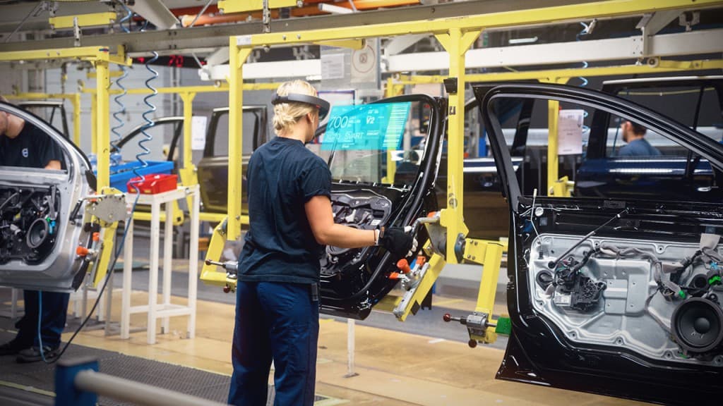 Yes, that's a guy wearing a HoloLens on an assembly line. Don't try this with a VR device!