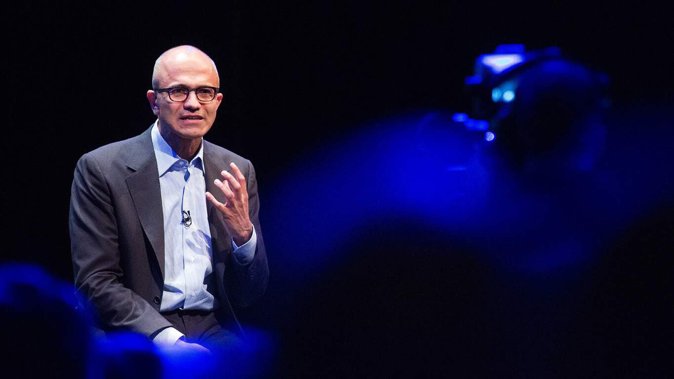 Singapore Government partners with Microsoft to explore Conversations as a Platform for public services 1 Satya Nadella, chief executive officer of Microsoft Corp., gestures as he speaks during the Future Decoded technology event at ExCeL in London, U.K., on Monday, Nov. 10, 2014. Microsoft recently unveiled an activity-tracking wristband and related Internet-based service that can track and analyze health, fitness and sleep data, jumping into the crowded wearable-computer market. Photographer: Jason Alden/Bloomberg