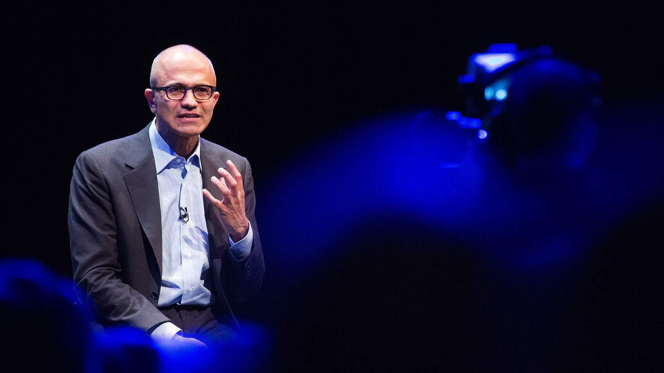 Satya Nadella, chief executive officer of Microsoft Corp., gestures as he speaks during the Future Decoded technology event at ExCeL in London, U.K., on Monday, Nov. 10, 2014. Microsoft recently unveiled an activity-tracking wristband and related Internet-based service that can track and analyze health, fitness and sleep data, jumping into the crowded wearable-computer market. Photographer: Jason Alden/Bloomberg 