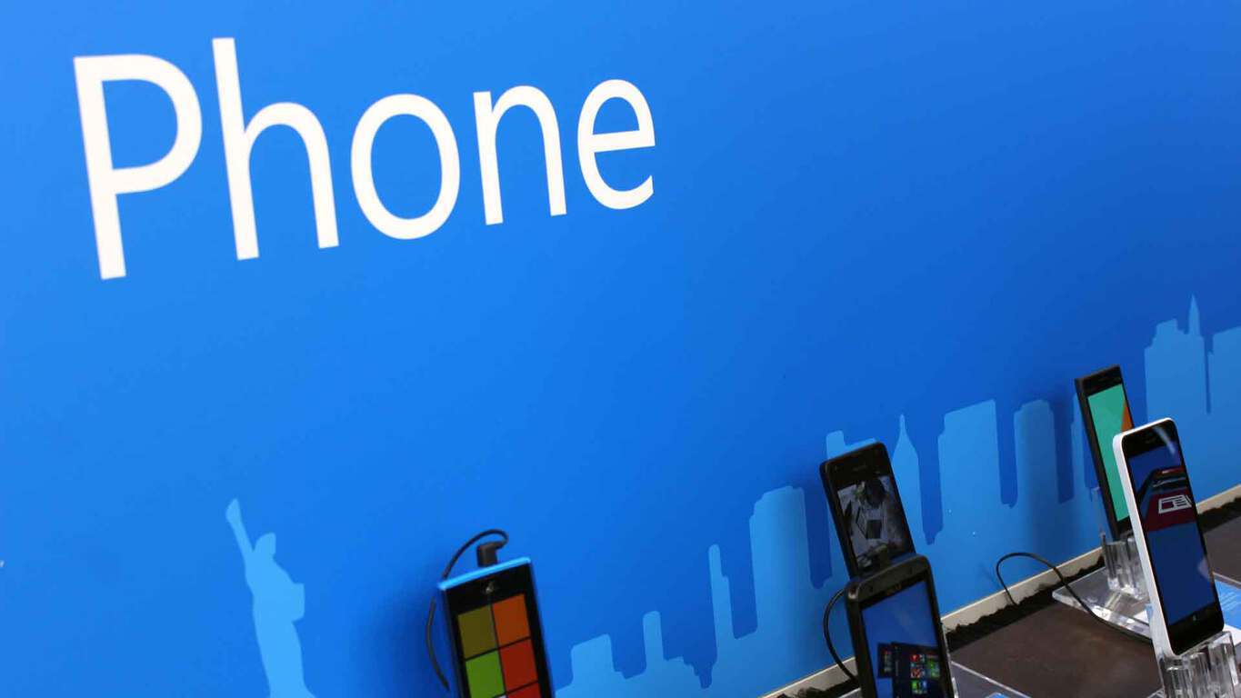 Photo of Windows phones lined up in a Microsoft store
