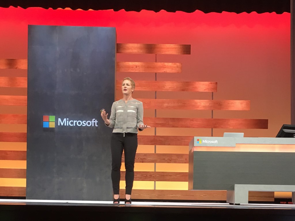 CVP Julia White onstage with Microsoft logos