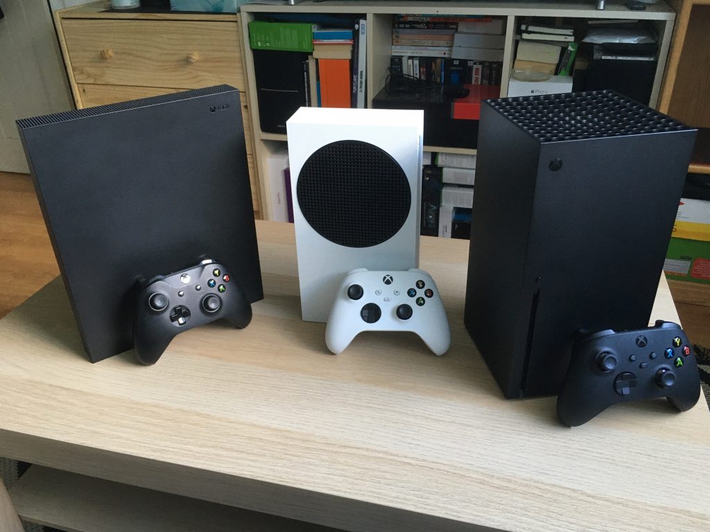 Xbox One X Next To Xbox Series S And Xbox Series X