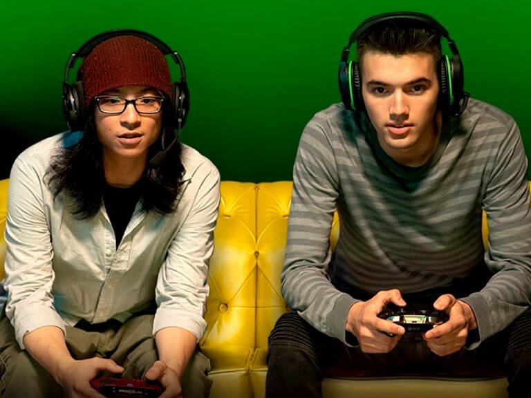 Two men playing video games on Xbox Series X